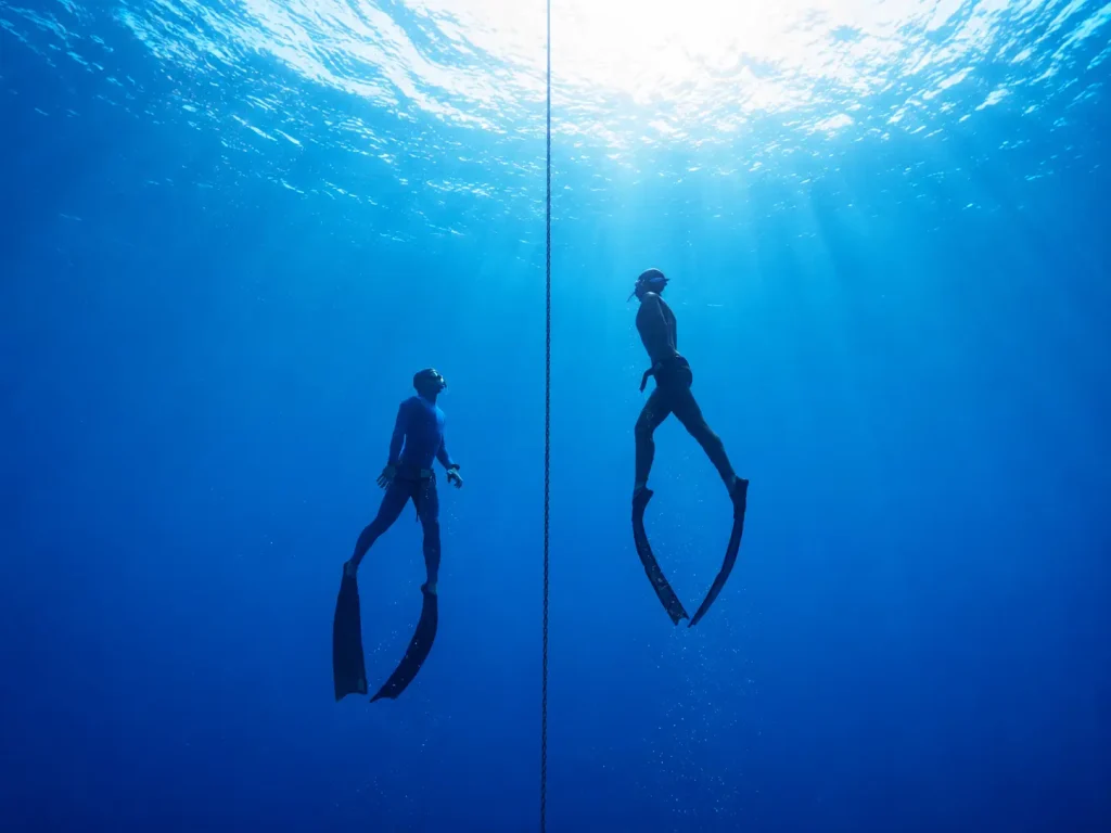 Freedivers training on a depht line in South Fuerteventura