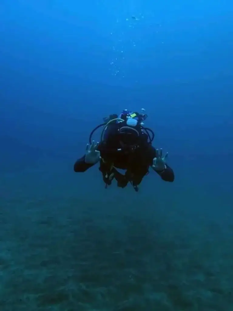 Scuba diver practising relaxation and underwater confidence in Fuerteventura