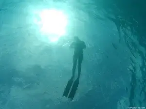 Freediver relaxing underwater during a freediving experience in Fuerteventura